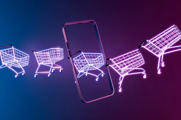 Mehrere Einkaufswägen sind zu sehen, bei denen es scheint, dass sie durch ein Mobiltelefon fahren