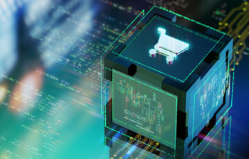 Ein leuchtender Würfel, auf der oberen Seite ist ein Einkaufswagen-Icon