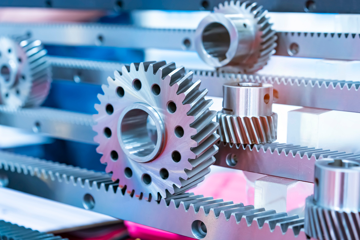 Metal cog gears on blue background